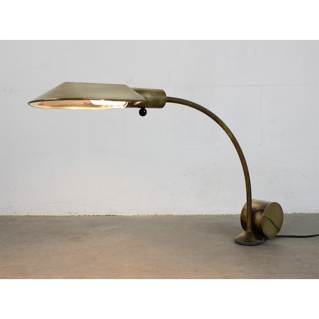 Lamp is signed, numbered and has production date 10-1992. Black ball under the socket is on/off switch. This piece has an...