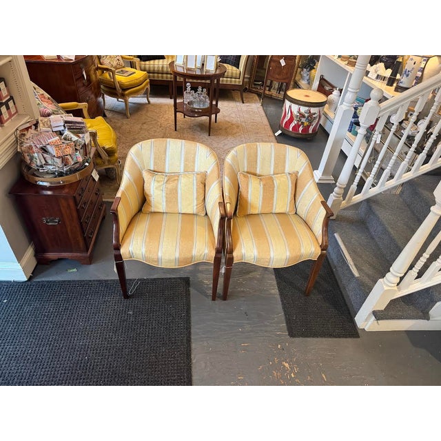 This is a pair of vintage striped hickory side chairs. They have been reupholstered with a striped pastel yellow and blue...
