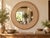 Row after row of tiny fern leaves climb around the frame of this round mirror, each one set in white inlay against raw,...