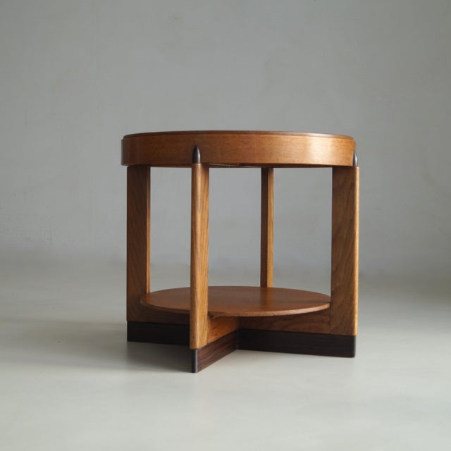 A strikingly modernist Dutch side table from the 1920s, rooted in The Hague School tradition, with subtle Amsterdam School...