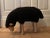 Equal parts iconic and adorable black sheep stool in the style of Lalanne. This wooden sheep sculpture features black wool...