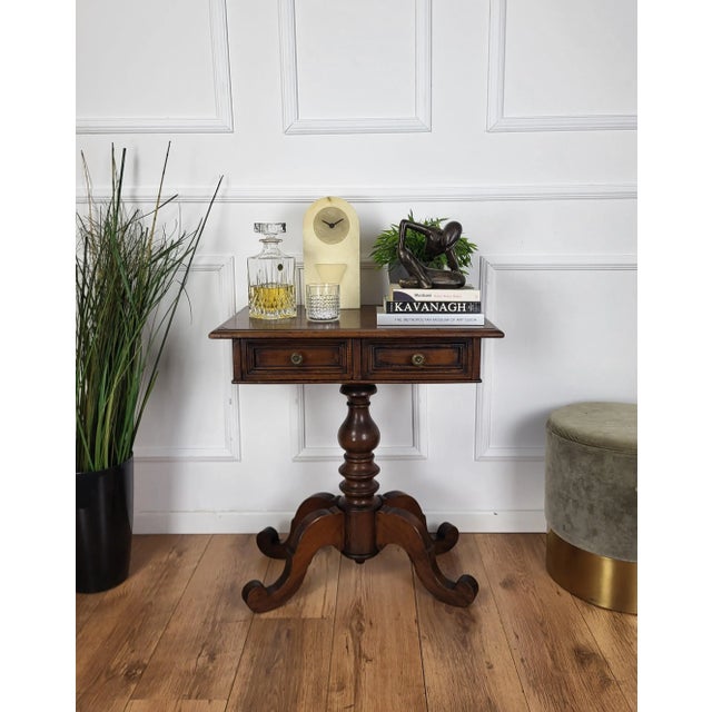 Beautiful and very elegant antique Italian solid walnut side table features an beveled top with two drawers and brass...