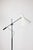 Single-arm floor lamp, designed by Angelo Lelii for Arredoluce. A chrome counterbalance arm carries a white enameled...