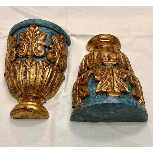 Introducing this extraordinary pair of Vintage Empire Style Carved Newly Gilded Wood and Faux Blue Marble Large Wall...