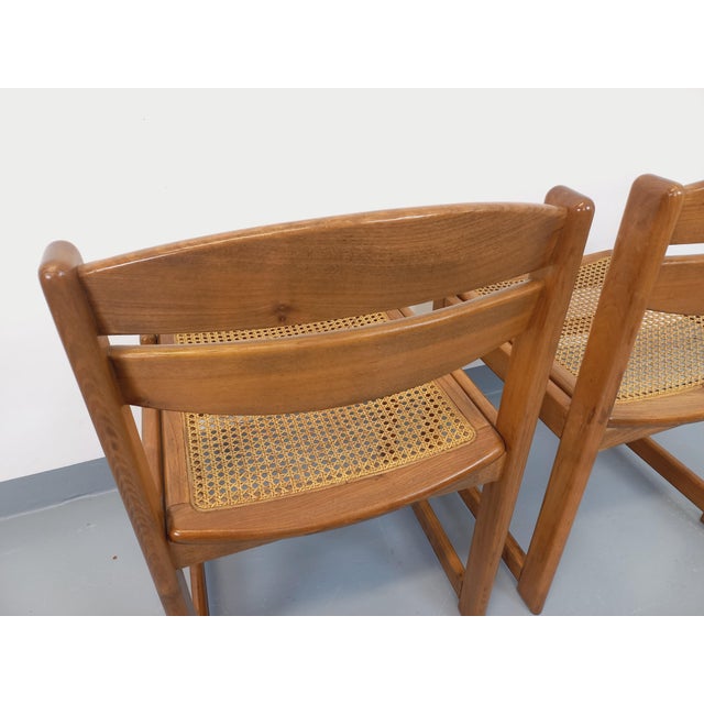 Set of two vintage chairs from the 1970s and 1980s, solid beech wood frames and backs, high-quality cane seats, sled legs,...