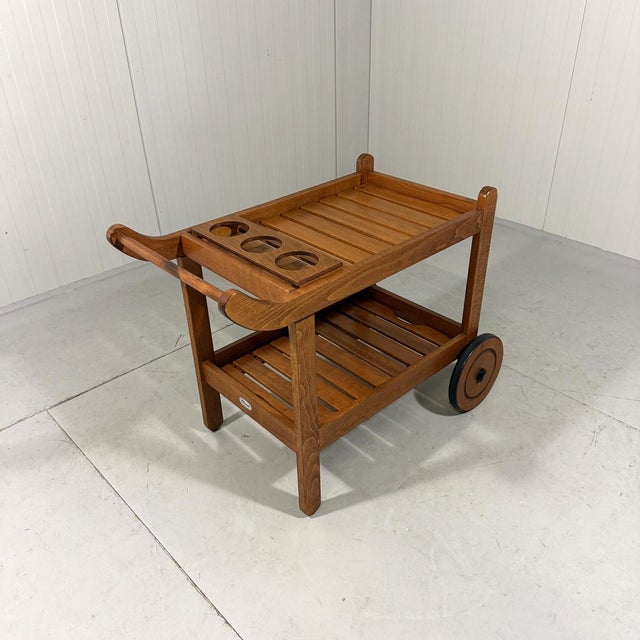Wooden garden trolley by Herlag Classic, Duitsland. Large wooden wheels, interchangeable table tops; 1 has a bottle...