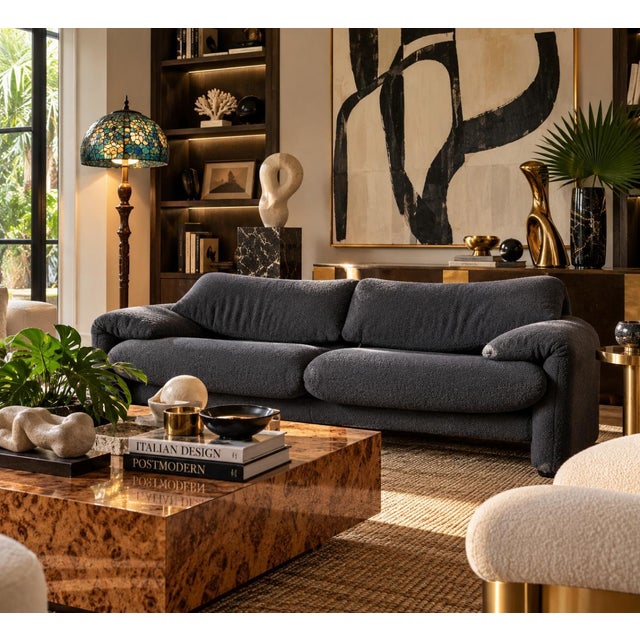 Iconic Italian modernist Maralunga two-seater loveseat sofa designed by Vico Magistretti for Cassina, Italy. Featuring a...
