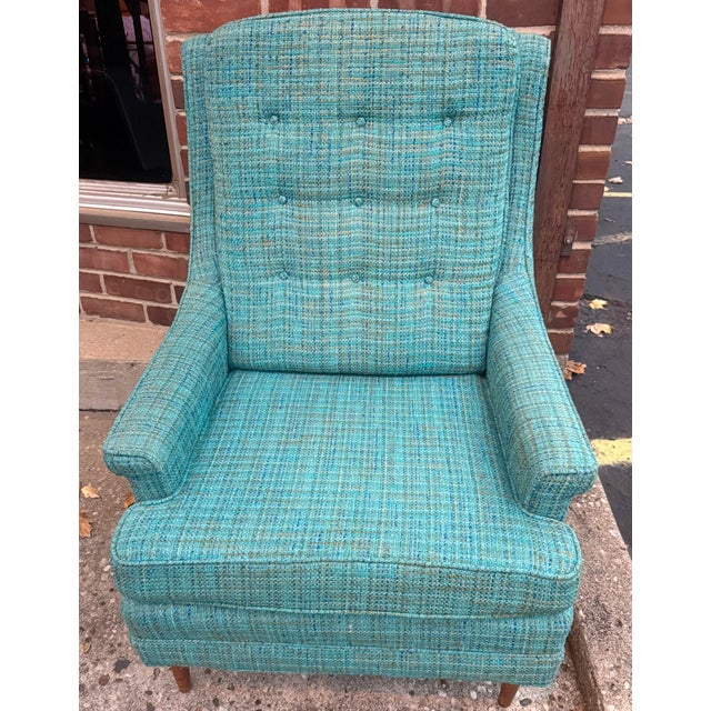 Vintage mid-century modern high-back armchair in a vibrant turquoise woven fabric with blue, green, and cream cross grain....