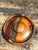 This exquisite vintage lidded box is a masterclass in artisanal woodcraft, featuring a sophisticated segmented design that...