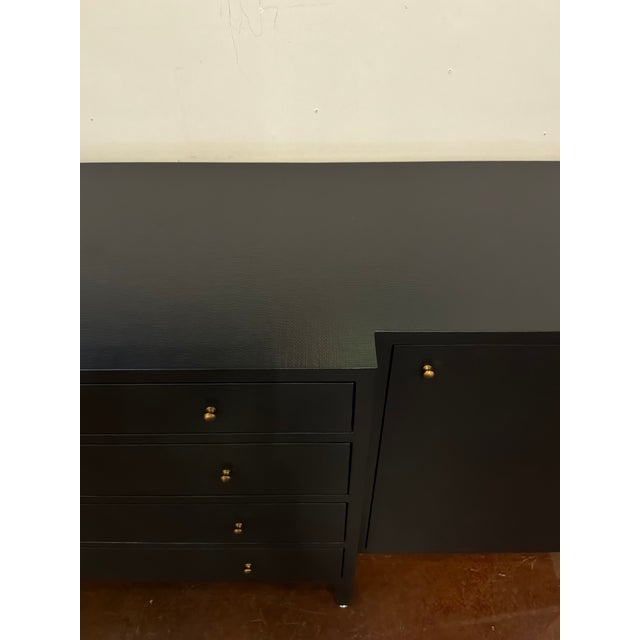 Made Goods Co Conrad Black Buffet. 4 drawers in the midle plus two cabinets with shelves on the side. Gold hardware....