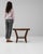 This piece presents as a table, distinguished by dark walnut, sculptural tripod leg. Originating in Czech Republic during...