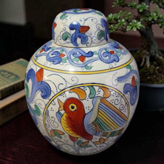 This vintage Asian hand-painted porcelain ginger jar features a beautiful bird motif, showcasing the traditional Chinese...