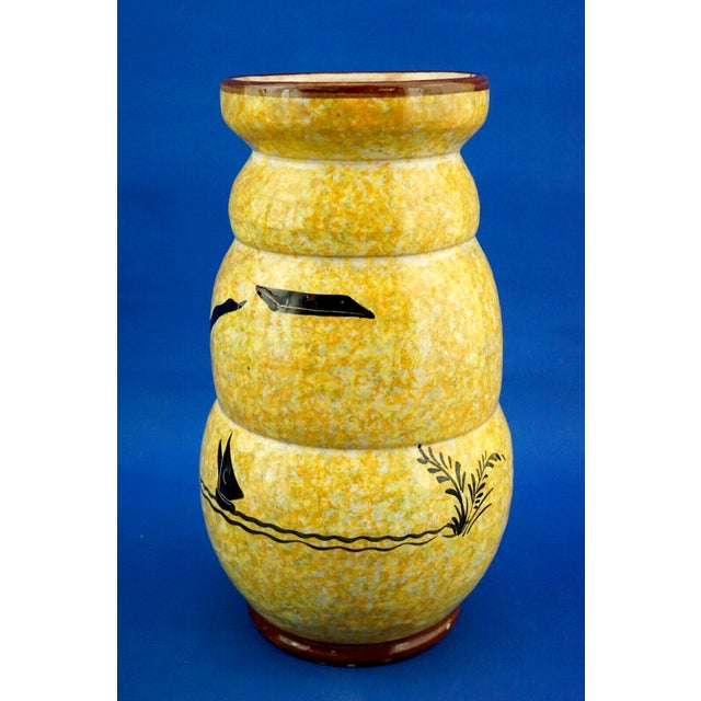 Item : A stunning trilobed, triple-bulbed ceramic vase, entirely hand-molded on a lathe, glazed, and vitrified. It is...