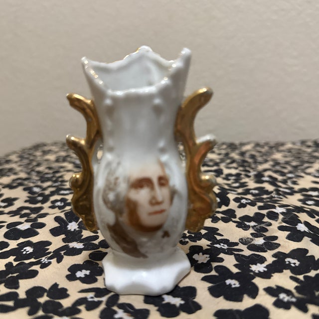 The item pictured is a vintage miniature George Washington souvenir vase, often used as a toothpick holder. These were...