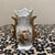 The item pictured is a vintage miniature George Washington souvenir vase, often used as a toothpick holder. These were...