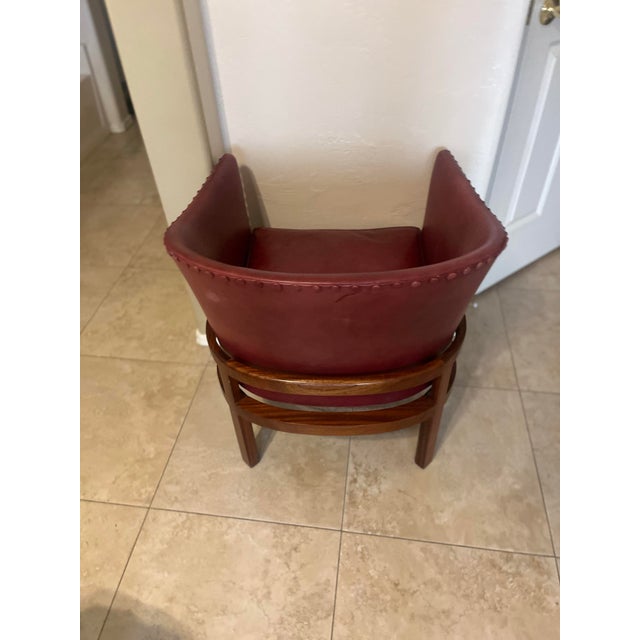 Four-legged constructions with solid wood frames, curved body and loose-fitting seat cushions covered with rasberry -...