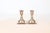 Set of two matching vintage brass candlestick holders featuring a classic and elegant mid-century modern silhouette....