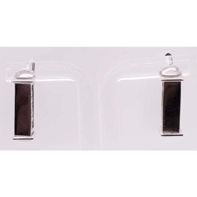 14 Karat White Gold Diamond And Ruby Reversible Hoop Earrings 8.95 grams total weight.