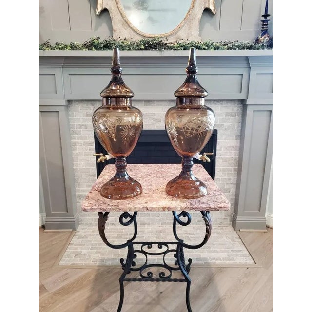 A spectacular pair of rare and highly decorative Bohemian faceted and etched glass covered urns, professionally converted...