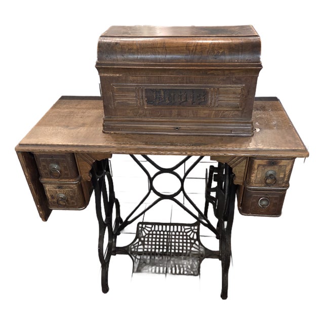 Antique Davis Treadle Sewing Machine in Wooden Cabinet With Ornate Cast Iron Base, Late 19th Century For Sale