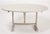 Vintage French tilt top wine table, in an antique white finish. Poplar top and oak base. Age unknown, top was added at a...