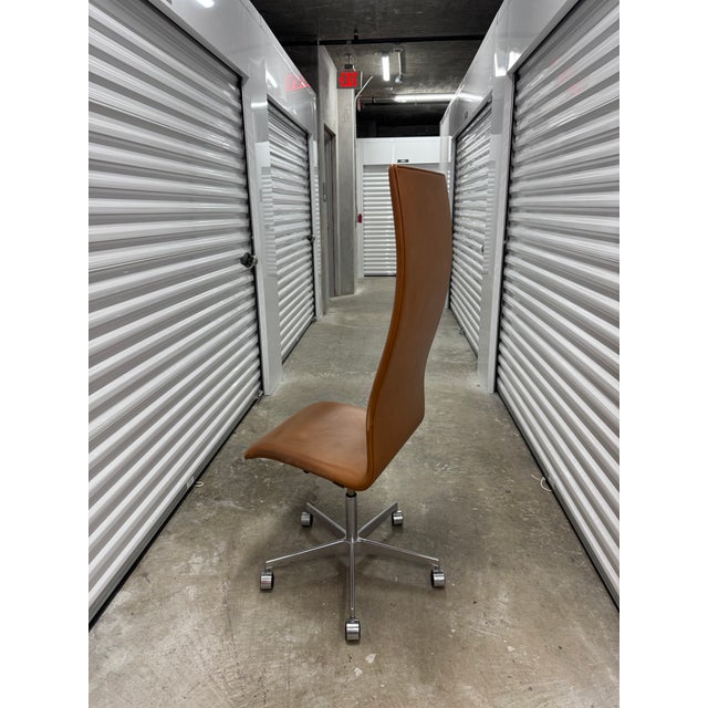 Arne Jacobsen Oxford “Professor” high-back chair, an iconic and rare version of the classic design that combines comfort...