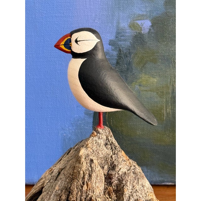 Handsome hand-carved and painted puffin on a driftwood. Signed Poisson on the bottom. Most items found at Pub & Oasis are...