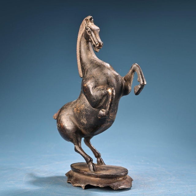 This is a beautiful and dynamic vintage Chinese bronze sculpture of a Rearing Horse. The steed is captured in a lively,...