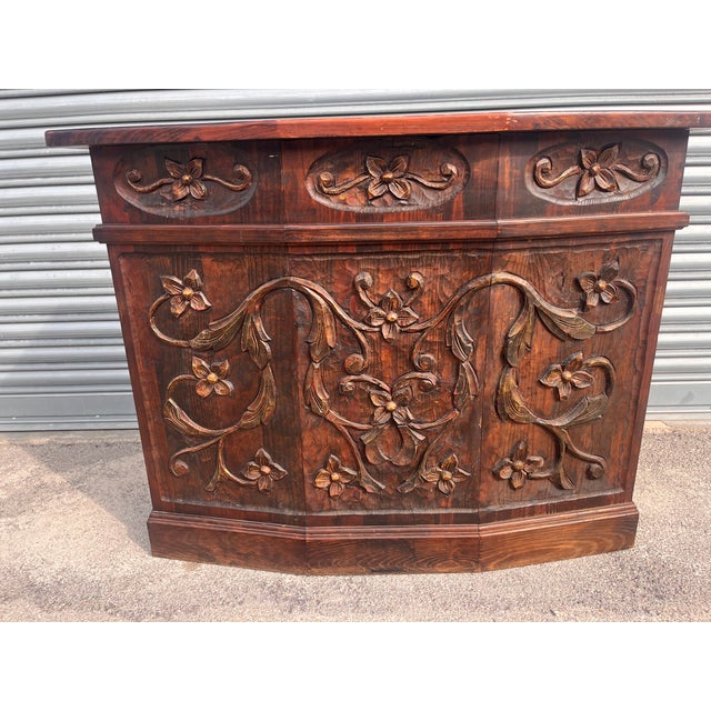 Art Nouveau Carved Wood Counter, 1900s Solid wood with floral carvings on the front and open interior with shelf Solid...