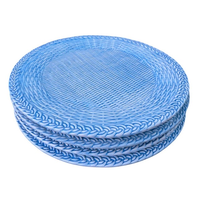 This elegant set of four ceramic plates by Les Ottomans features a charming, artisanal design that perfectly captures a...