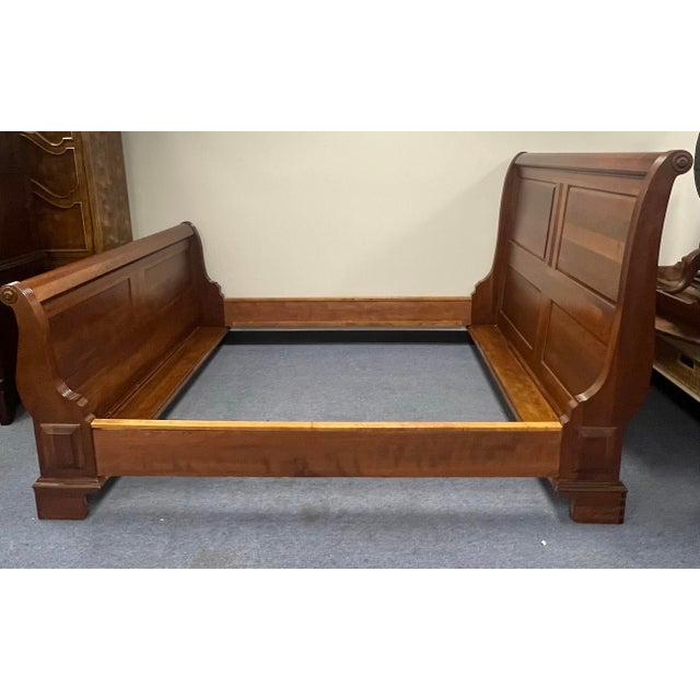 Beautiful queen size solid cherry sleigh bed by Pennsylvania house. The rich warm patina of the cherry is accented by the...