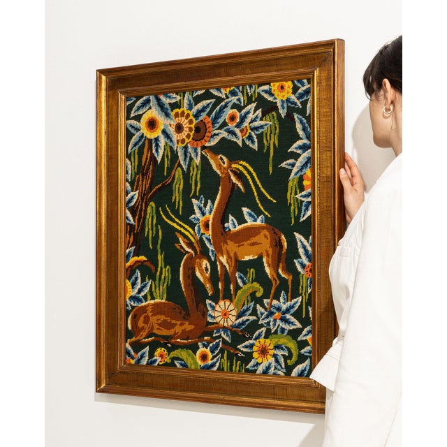 This 1960s wall hanging from France is a tapestry, housed in a tapestry frame. It is distinguished by its antelopes, a...