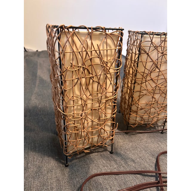 These are two very cool vintage rattan table lamps in excellent condition. The matching pair and size make them a perfect...