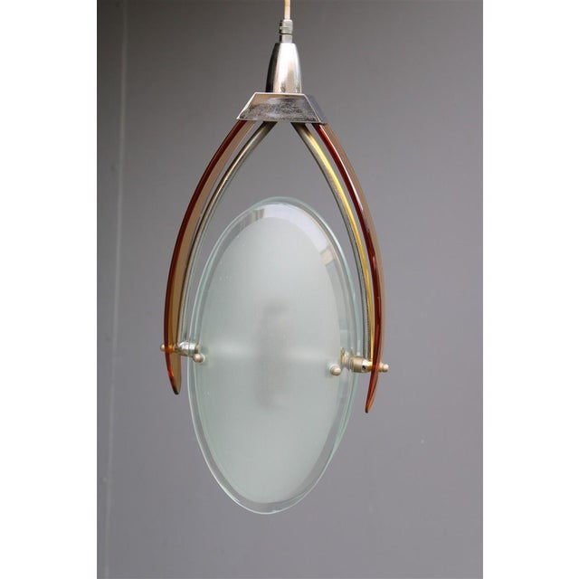 Minimalist Orange Pendant from Fontana Arte, 1960s, in Very Good conditions. Designed 1960 to 1969 This piece has an...