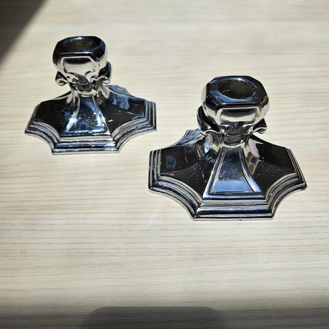 One pair vintage Art Deco candlesticks. Approximate 3" tall. NOTE: Some reflections appear as colored spots in the photos....