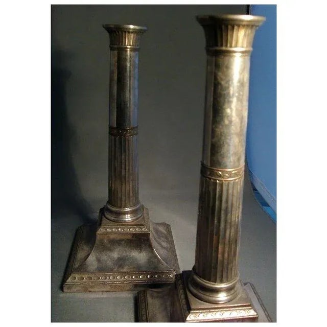Pair antique Sheffield candlesticks in the neoclassical taste that would be pleasing in a Federal interior. Each measures...