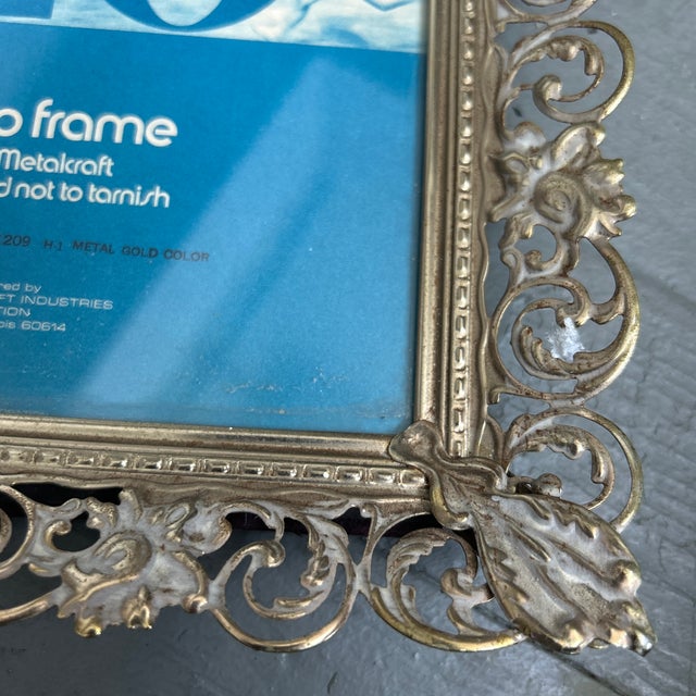 1970’s ornate metal photo frame. Fits 5x7 photo and measures 7x9 overall. Check out my shop Robins Egg Gallery for more.
