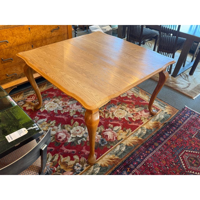 Design Plus Gallery presents Extension Dining Room Table in the Queen Anne Style. The table is made of oak wood with a...