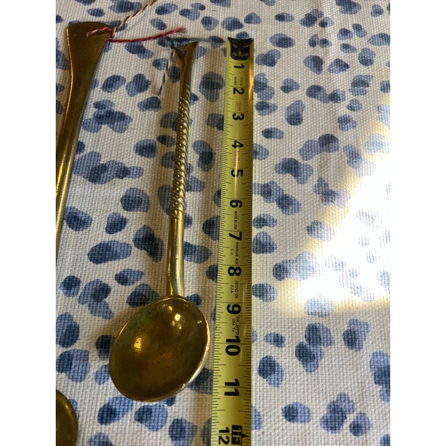 Up for consideration is a beautiful vintage pair of brass serving spoons. These would look lovely in your home and they...