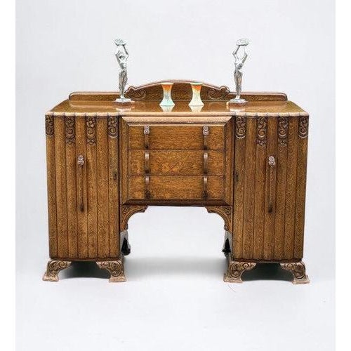 Art Deco Oak Sideboard. Circa 1930’s. Carved with Flowers . Lots Of Storage. The figures on the first pic are props and...