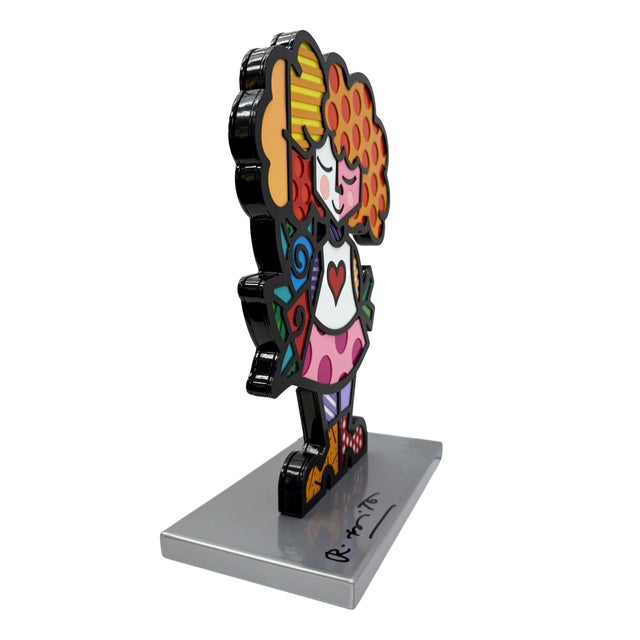 Enamel on iron sculpture. Hand signed on the base by Romero Britto. Hand numbered 812/100 on the base. Size: 11.75 x 6.75...