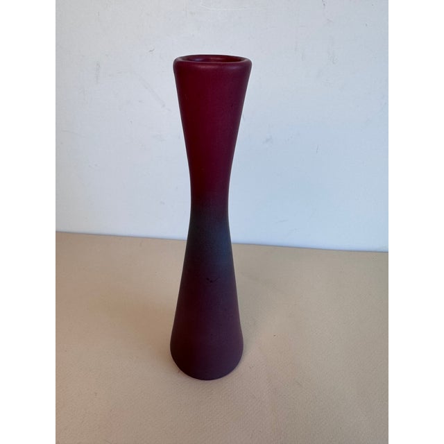 This hourglass shaped vase dates back to the early 1900's. A simple and timeless shape that can be grouped with more...