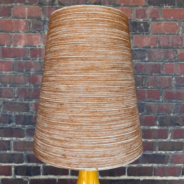 This golden yellow Lotte and Gunnar Bostlund lamp is a prime example of Danish MCM style. It has a great shape that...