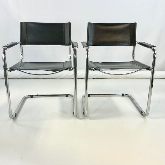 This pair of Tubular Chrome Frame Side Chairs with black leather seats and back rests are from Italy. They are in the...