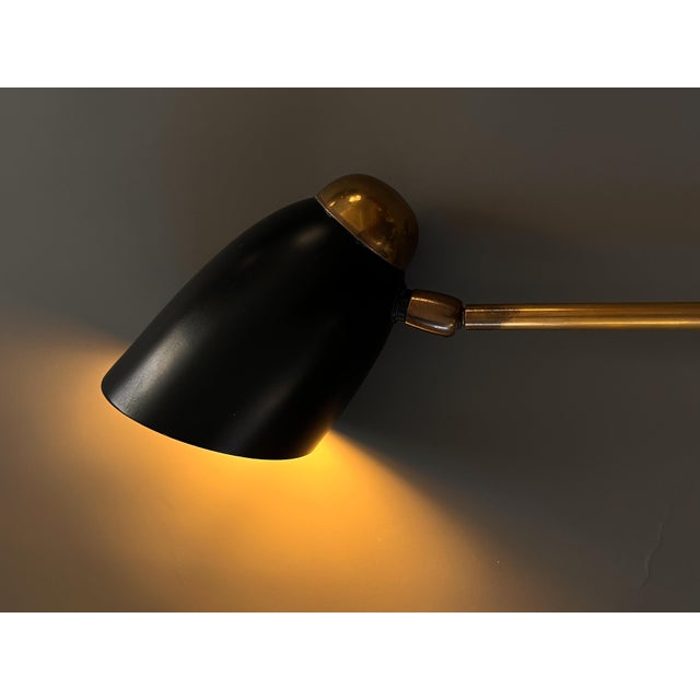 An exceptionally rare lamp for the true MCM enthusiast. This piece, originating from 1950s Europe, showcases beautiful...