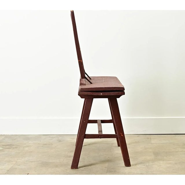 This metamorphic antique from the Netherlands (19th century) is a rather primitive-looking chair that flips over into a...