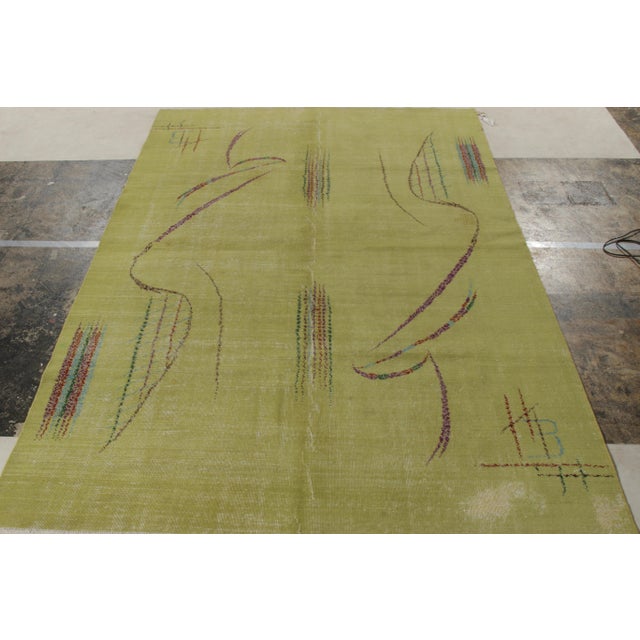 Originating from Turkey circa 1960-1970, a vintage 6x9 Art Deco rug from Rug & Kilim’s growing Mid-Century Pasha...