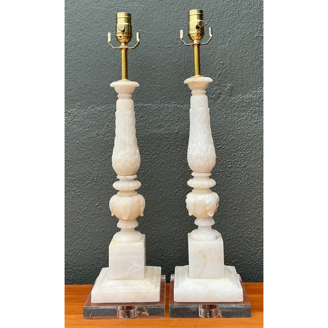 Elevate your interior with this stunning pair of vintage Neoclassical table lamps. Expertly hand-carved from genuine...