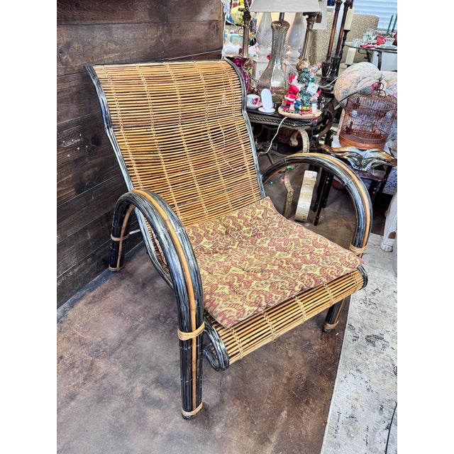Add a touch of retro charm to your home with this stunning vintage rattan and metal armchair. This one-of-a-kind piece is...