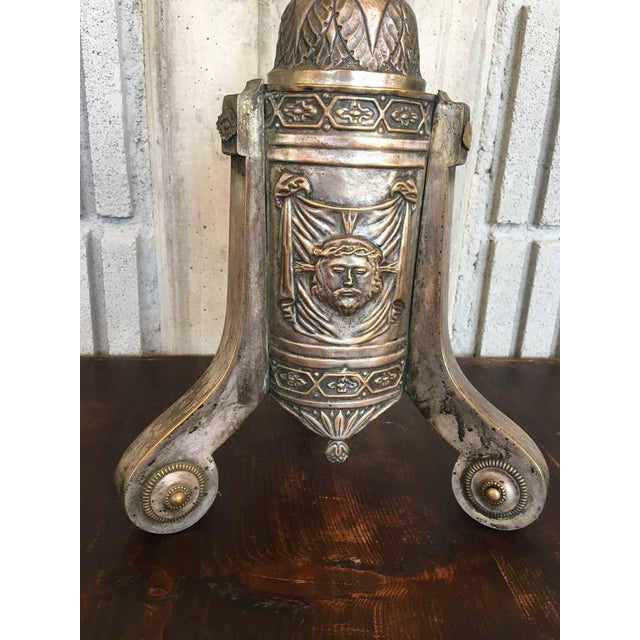 Antique silver-plated copper candlestick with embossed decoration, 19th century, in fair condition with all the signs of...